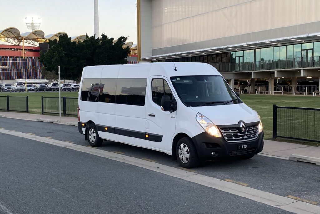 renault-master-12-seater-minibus-parked at heritage-stadium-on-the-way-to-an-airport-transfer